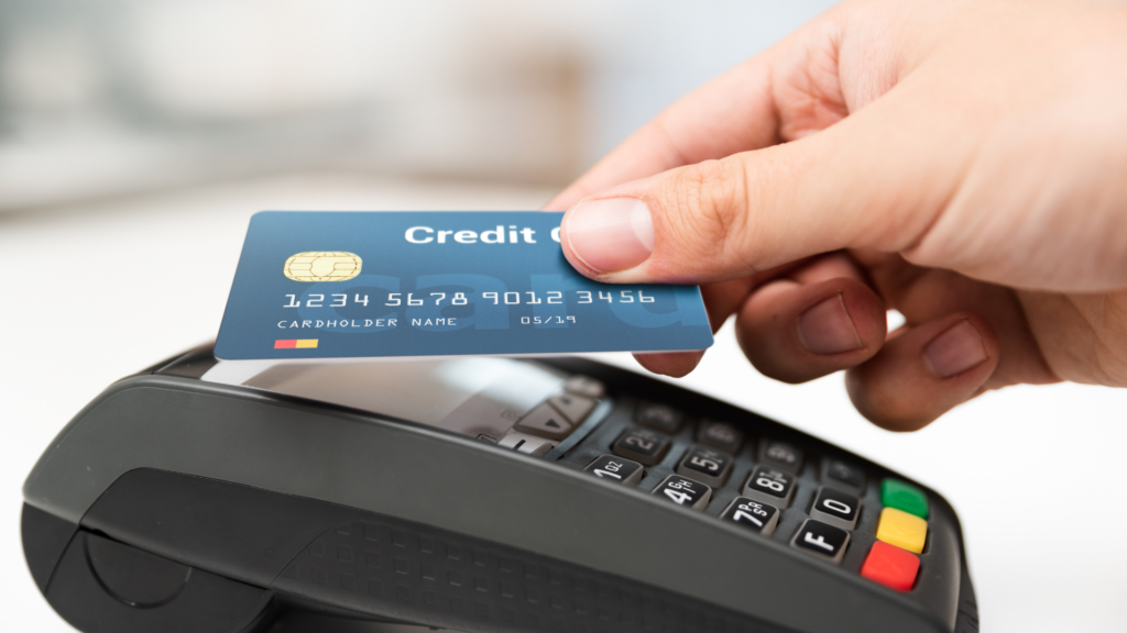 Using Credit Cards in Argentina Traveler paying by credit or debit card at a terminal in Argentina