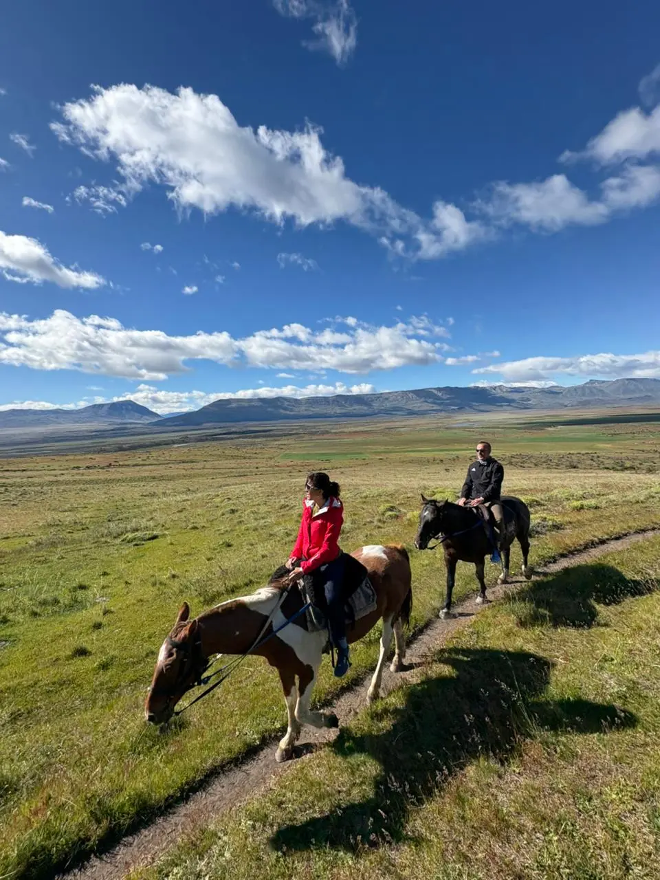 Liliana and Luis on a private horseback riding excursion through the scenic landscapes of El Calafate.